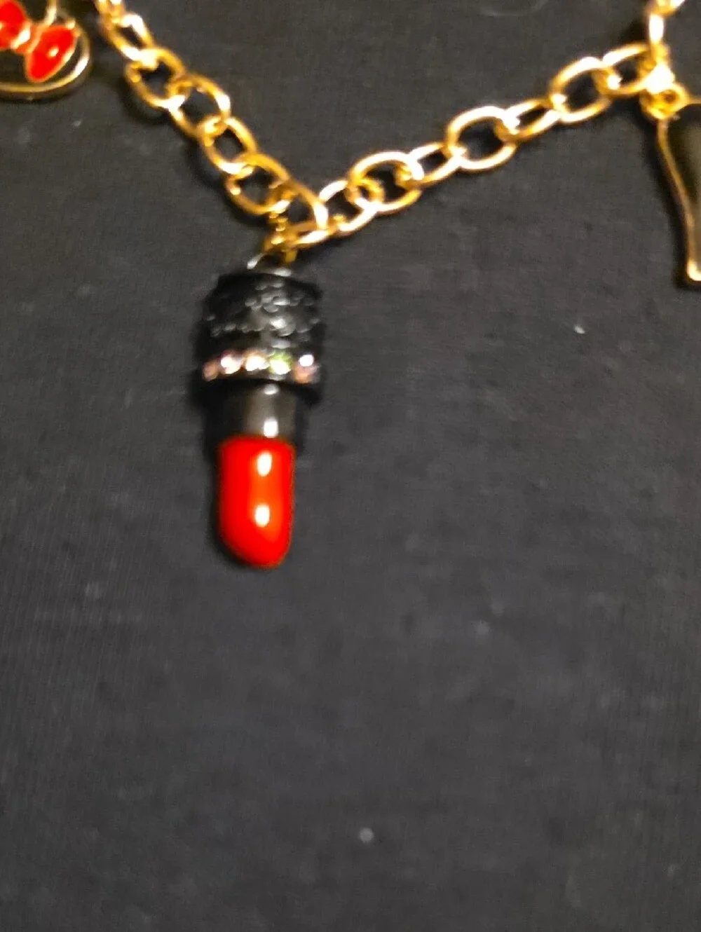 Gold-Tone Charm Bracelet with Red Enamel Accents